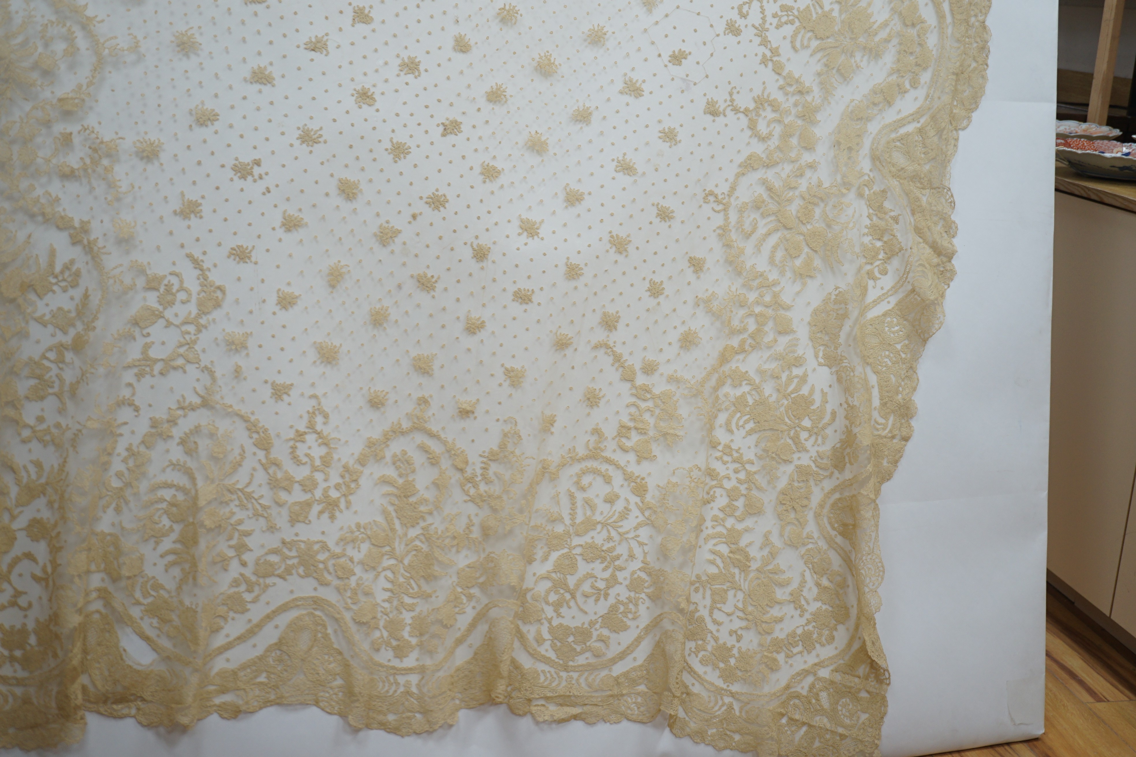 A rare length (9 and a half yards) of Brussels 19th century needle lace, some repairs and damage, circa 1880 and a similar wedding veil